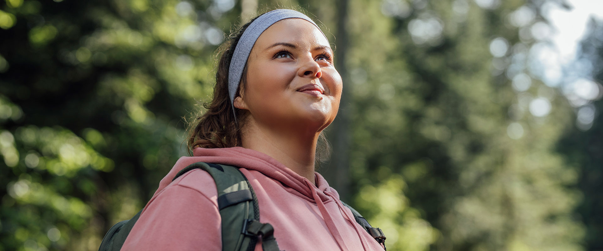 Hopeful young woman hiking