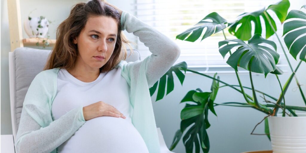 sad pregnant woman with perinatal depression