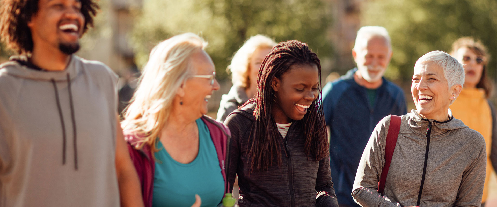 Smiling group of people walking together outdoors