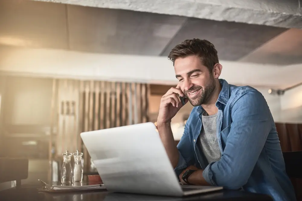 Young man sitting in front of laptop
