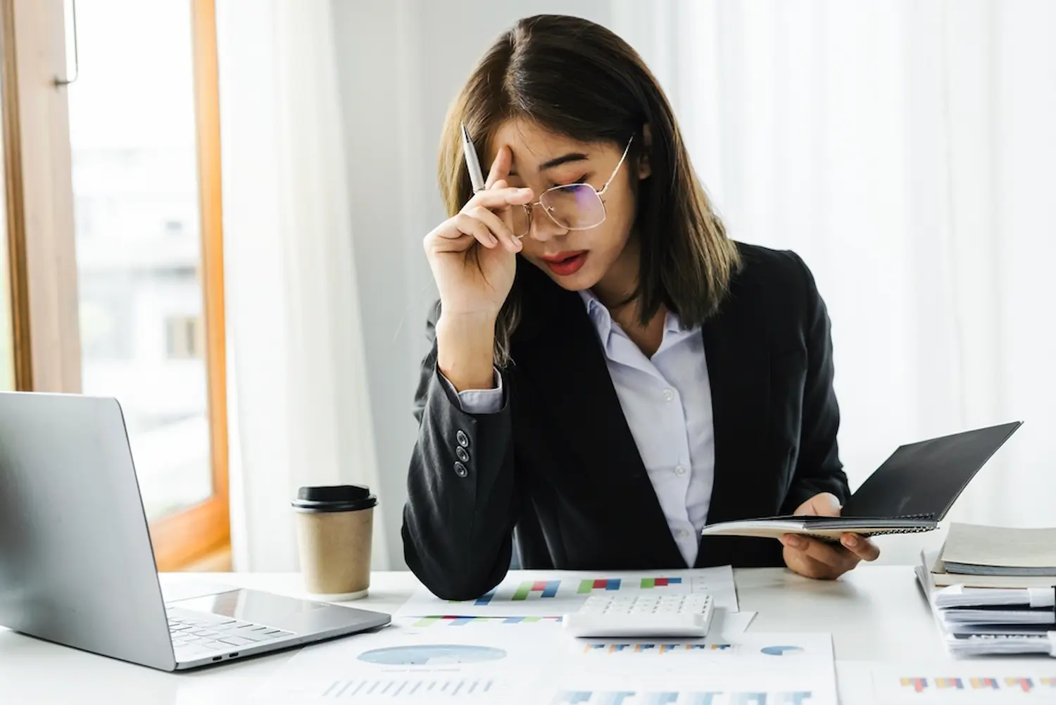 Stressed young woman at work