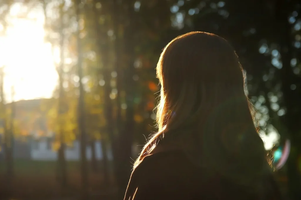 Woman standing in forest