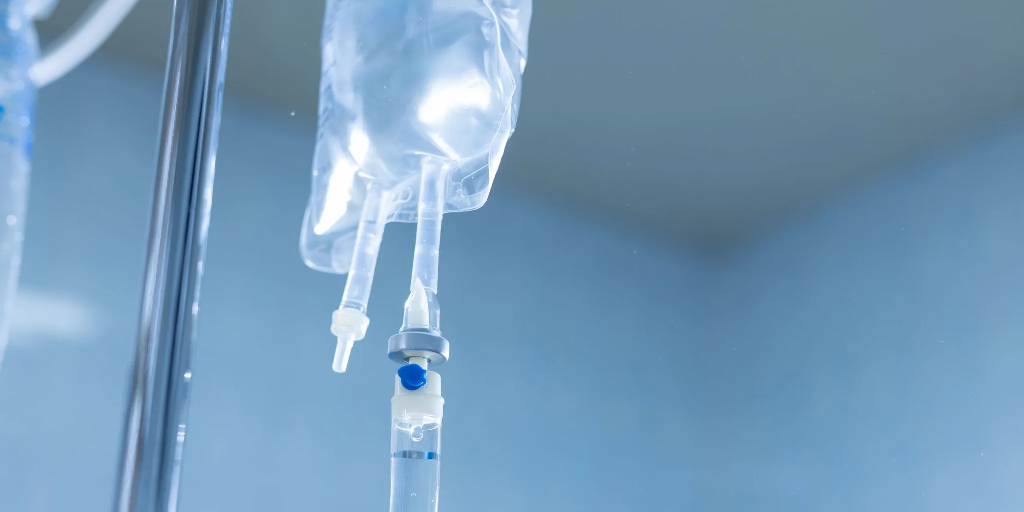 Comfortable clinical treatment room where a patient receives a supervised IV infusion for depression