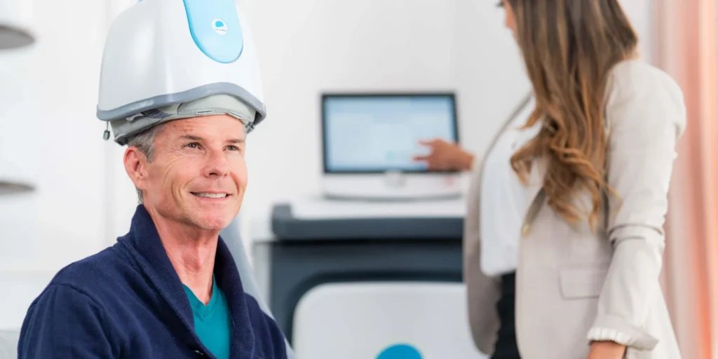 Man receiving BrainsWay Deep TMS therapy from a clinician in Warren, New Jersey.